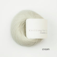 Load image into Gallery viewer, Cream-colored yarn skein with 'Knitting for Olive' label on a white background