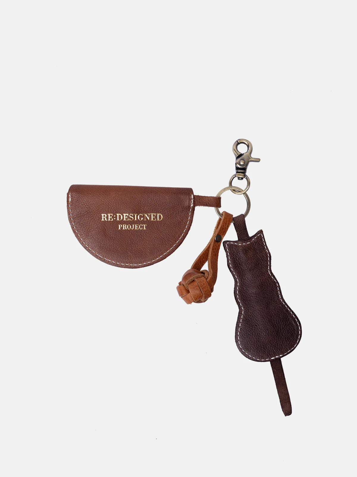 Brown leather keychain with cat design and 'Redesigned Project' branding on a white background