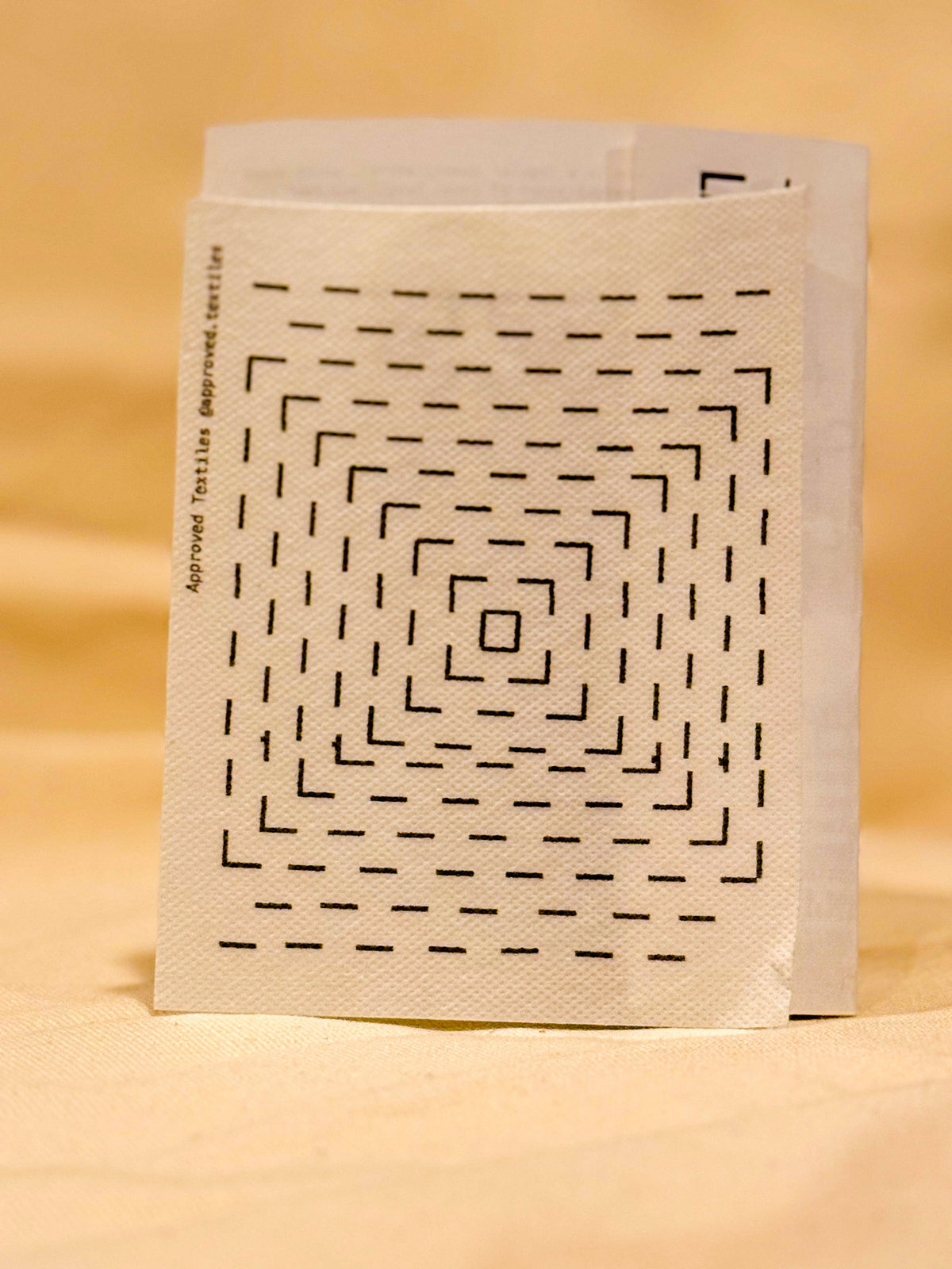 Approved Textiles Waffles visible mending transfers featuring geometric grid patterns inspired by the texture of a waffle.