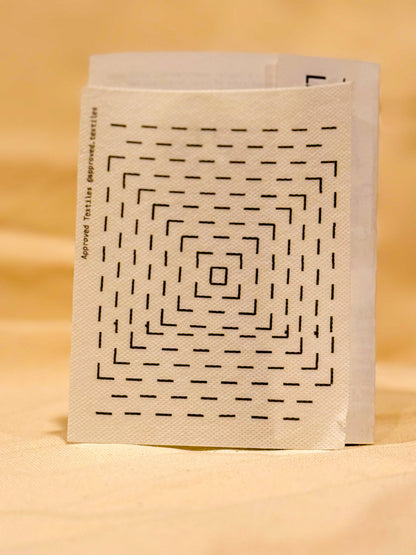 Approved Textiles Waffles visible mending transfers featuring geometric grid patterns inspired by the texture of a waffle.