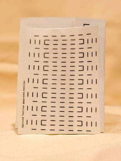 Approved Textiles Waffles visible mending transfers featuring geometric grid patterns inspired by the texture of a waffle.