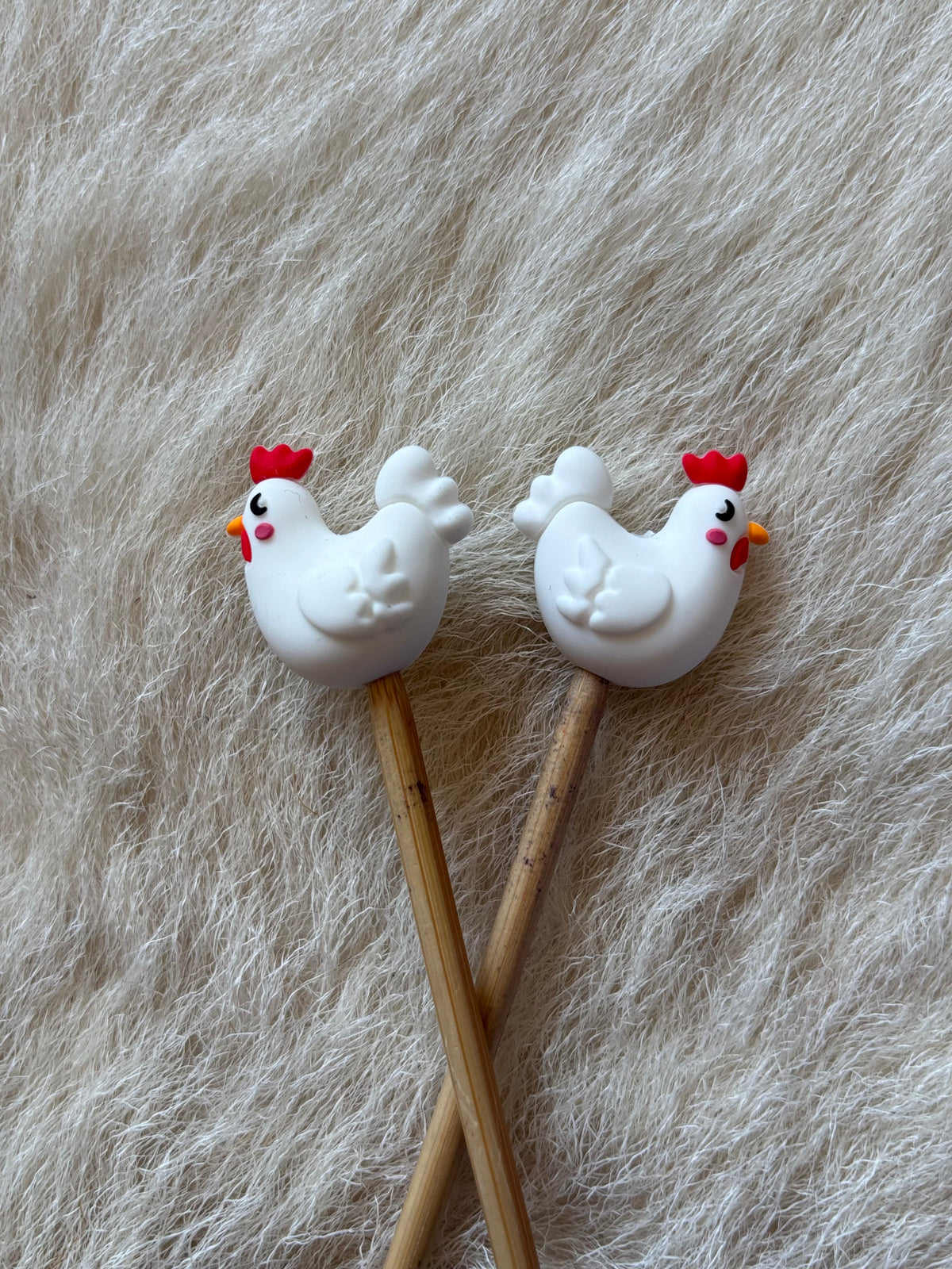 Chicken knitting needle point protectors.