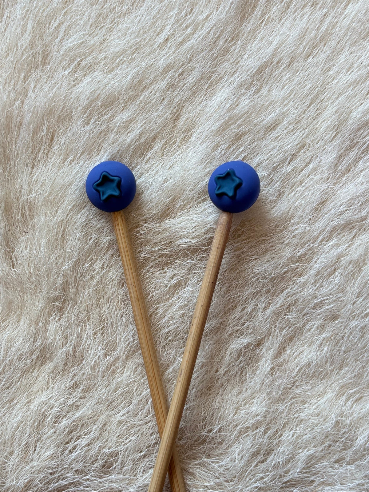 Blueberry knitting needle point protectors. 