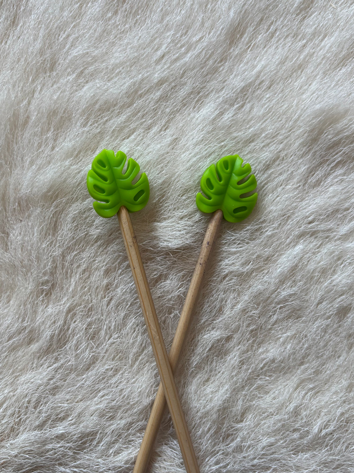 Monstera Leaf (assorted colors) knitting needle point protectors. 