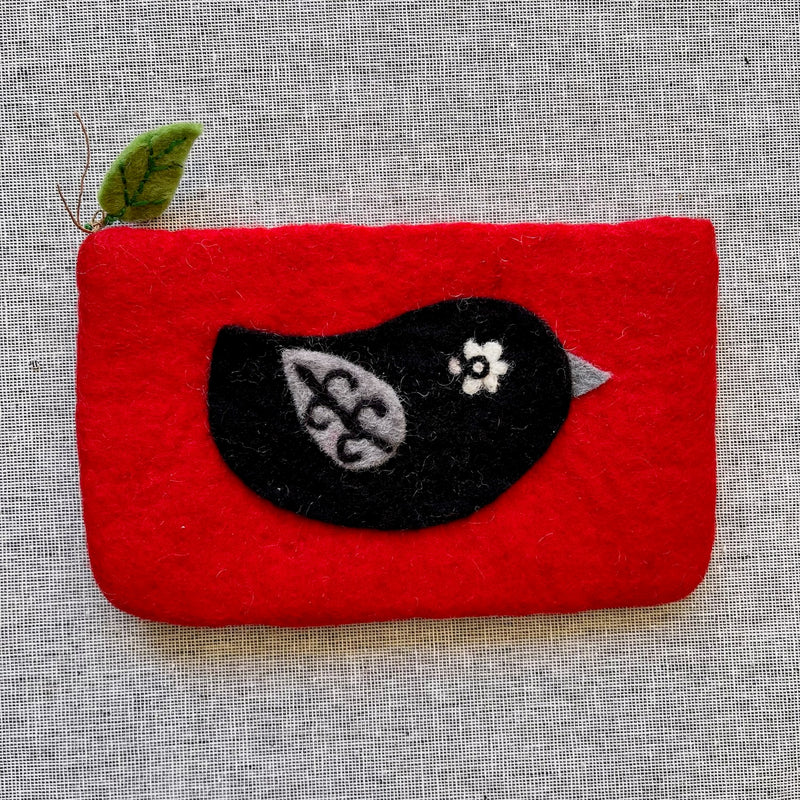red pouch with black bird