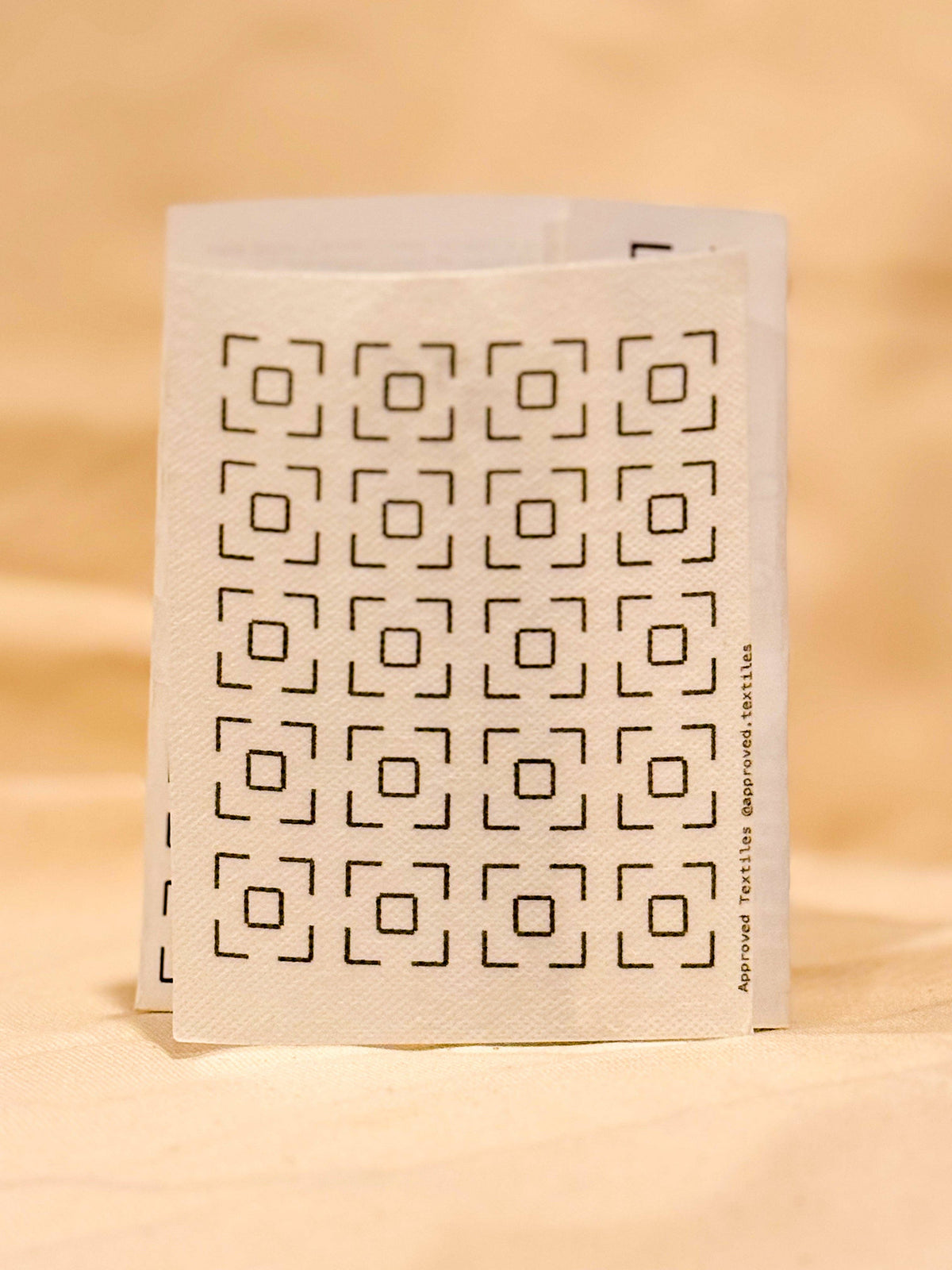 Approved Textiles Waffles visible mending transfers featuring geometric grid patterns inspired by the texture of a waffle.