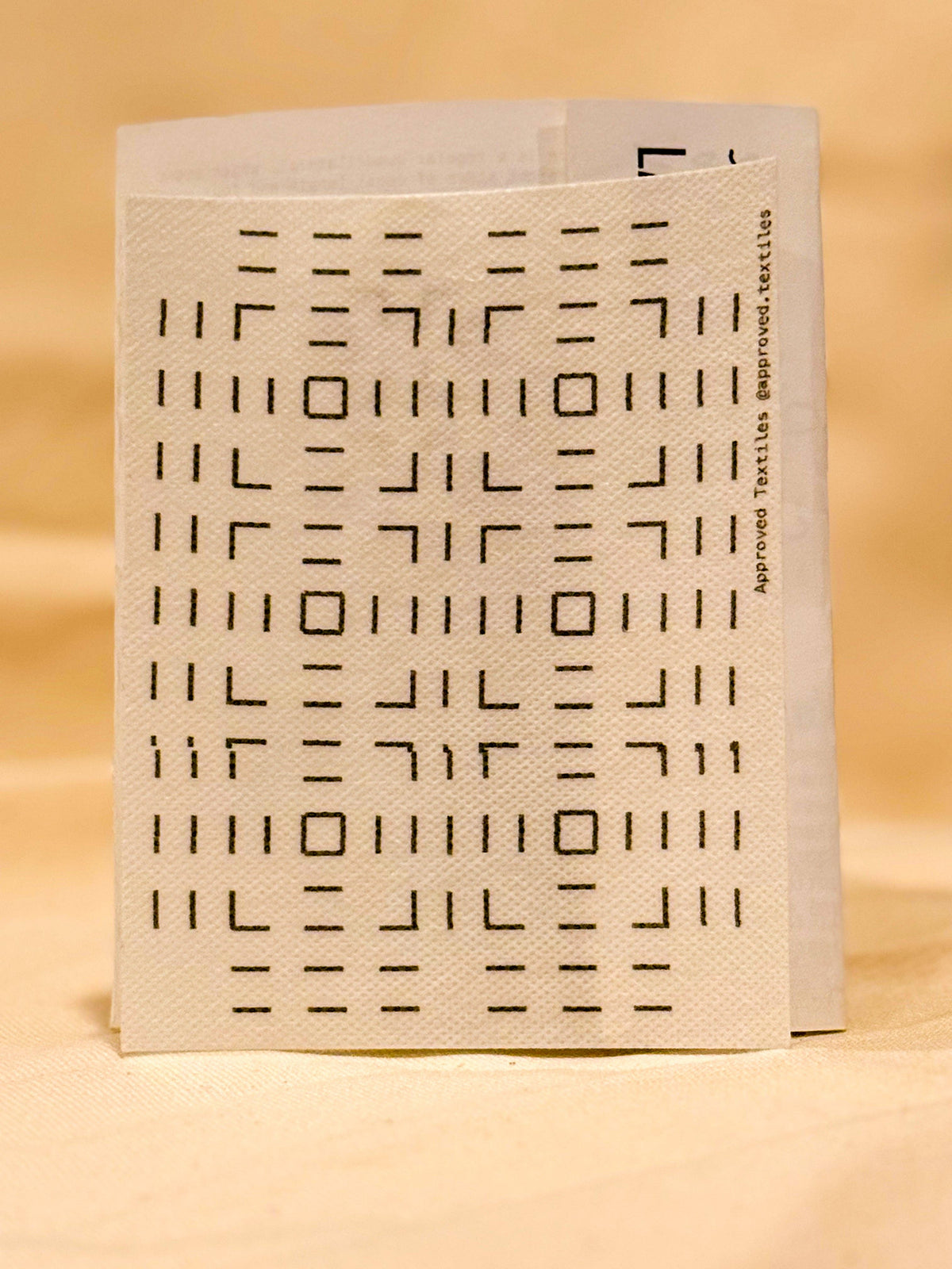 Approved Textiles Waffles visible mending transfers featuring geometric grid patterns inspired by the texture of a waffle.