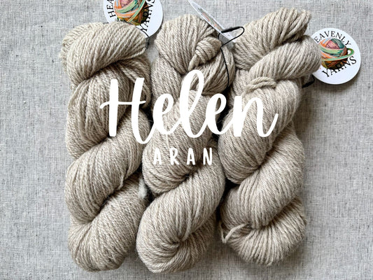 Three skeins of yarn labeled 'Helen Aran' on a gray background with Heavenly Yarns branding.