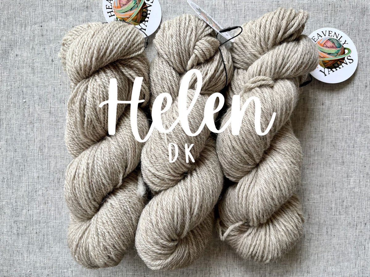 three skeins of Helen DK weight wool yarn in natural