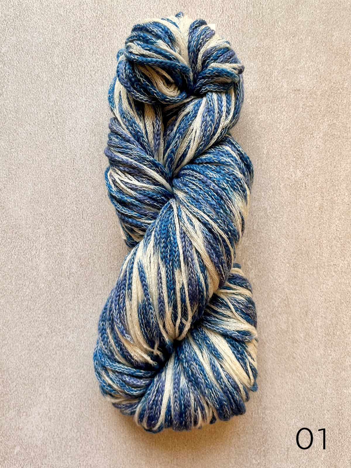 Plymouth Sea Glass worsted weight cotton and merino wool yarn, featuring softly blended colors and a textured chainette construction in color 01