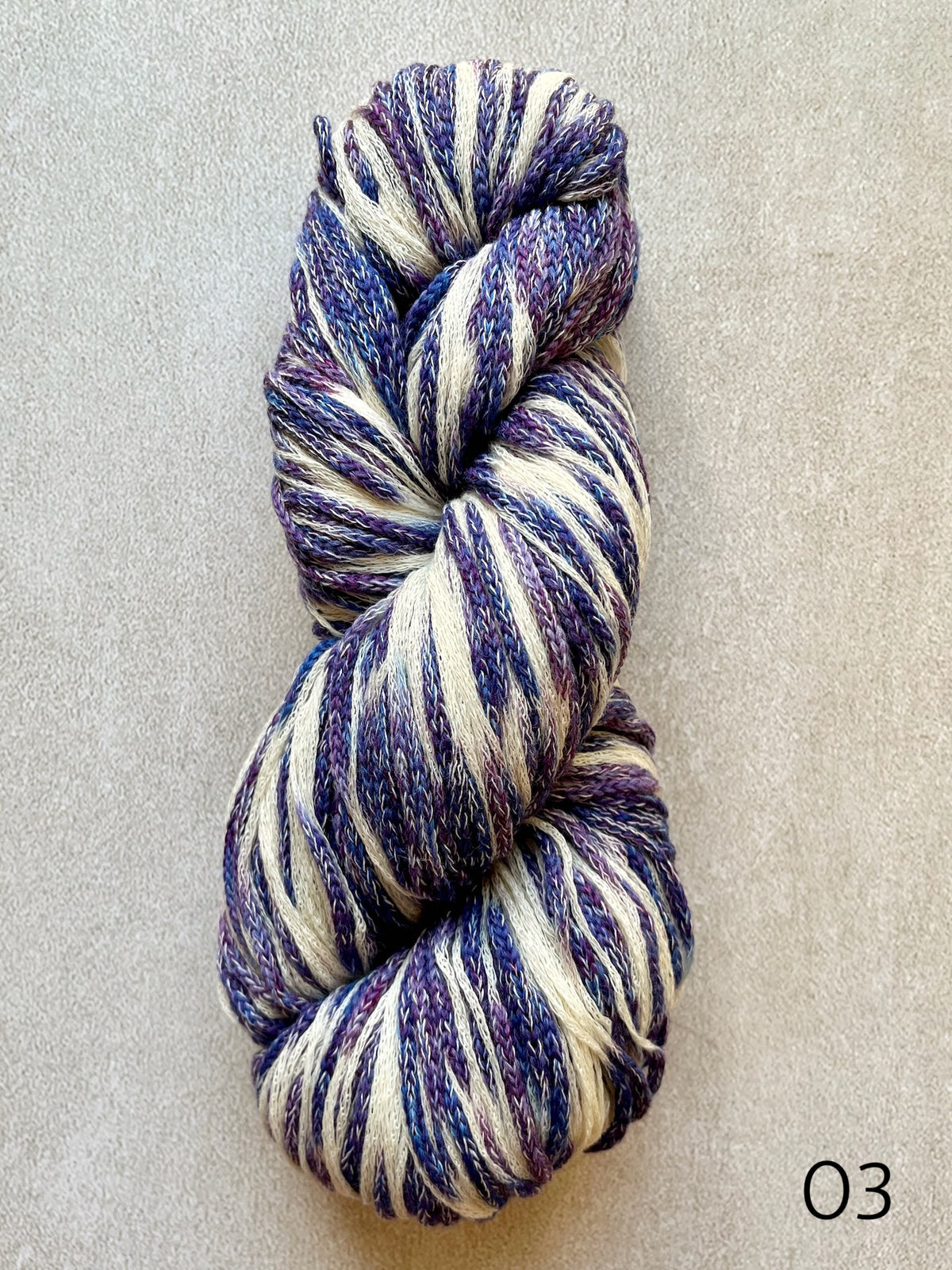 Plymouth Sea Glass worsted weight cotton and merino wool yarn, featuring softly blended colors and a textured chainette construction in color 03