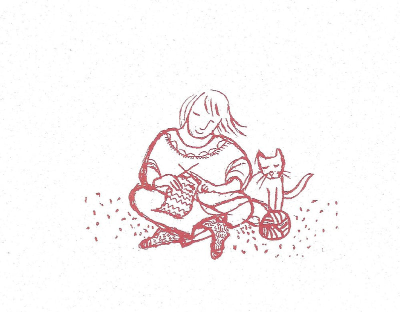 Girl knitting with cat